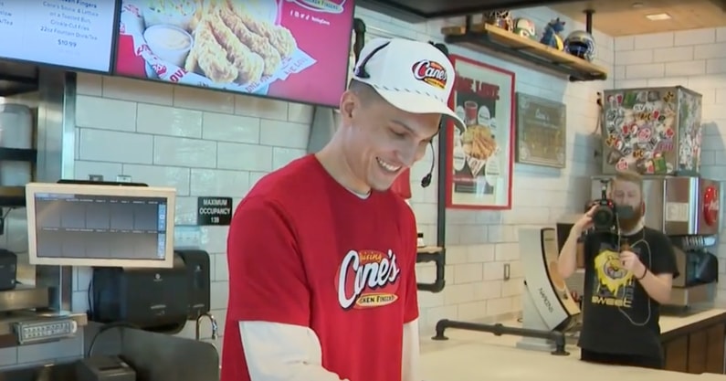Tyler Herro serves food at Raising Cane's